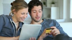 stock-footage-young-couple-at-home-buying-on-internet1